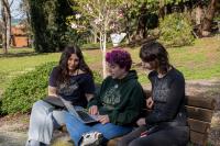 Students sitting outside having a discussion
